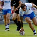 Kyle Evans scores for Wakefield Trinity against Wigan Warriors.