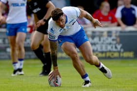 Kyle Evans scores for Wakefield Trinity against Wigan Warriors.