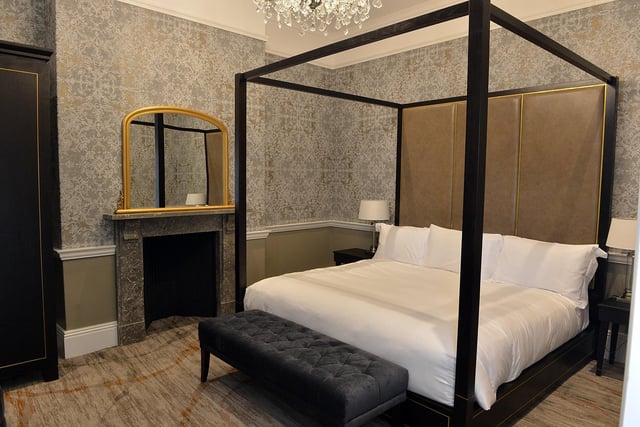 Huge four-poster bed in one of the suites