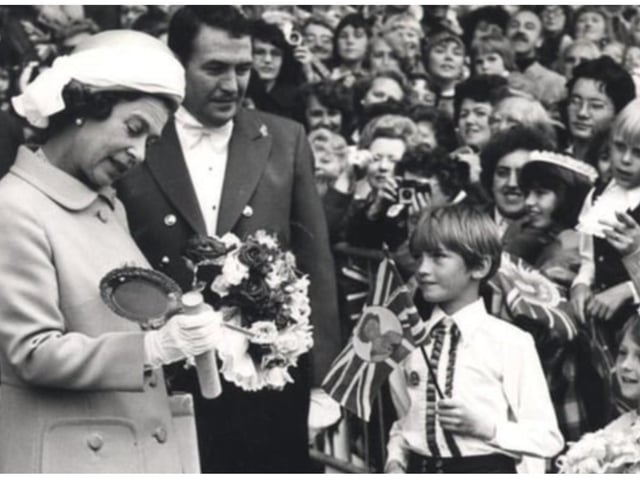 Sharing a joke with youngsters on a visit to Doncaster Racecourse.