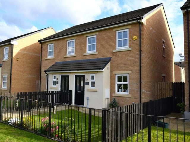 A front view of the modern, semi-detached home.
