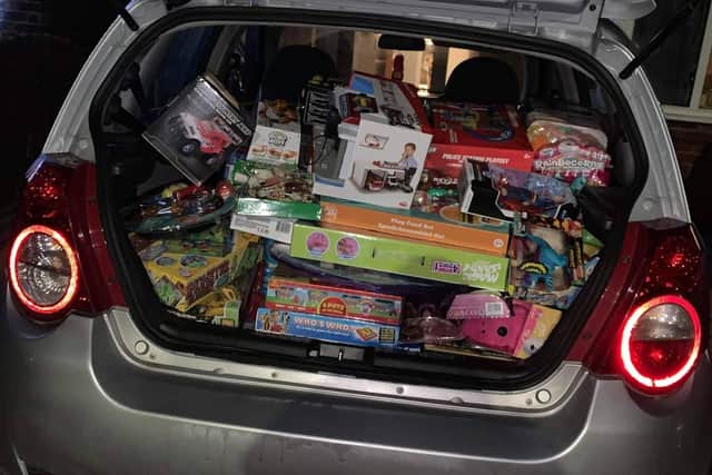 David's car filled with toys that he donated to families.