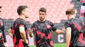 Tommy Rowe has joined Premier League giants Manchester United in a hybrid, player-coaching role with their under-21s side.