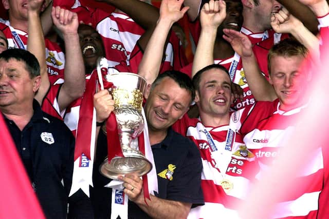 Dave Penney admires the Third Division trophy in 2004.