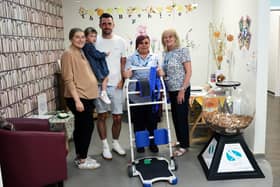 Nathan Allinson is pictured (centre) with his family presenting his equipment donation to the St John’s Hospice Team.