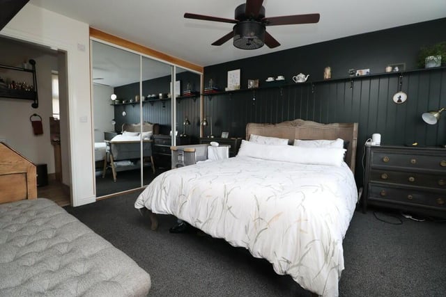 One of the property's double bedrooms, with built-in wardrobes.