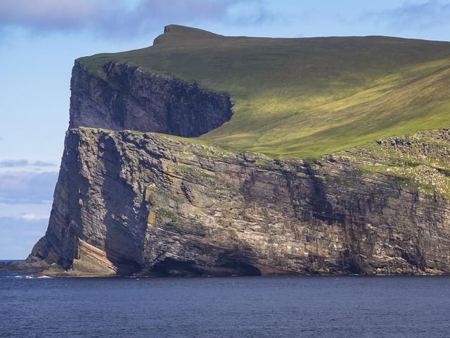 With a population of approximately 30, Foula is a truly remote island, found in Shetland. It boasts a huge array of birds and plants alongside spectacular, picture-perfect cliffs.

Ferry departures go seven nights a week on an Aberdeen-Lerwick route, or you can fly from several airports in the UK or Bergen, Norway.