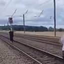 Two men were filmed running along the East Coast Main Line. (Photo: X).