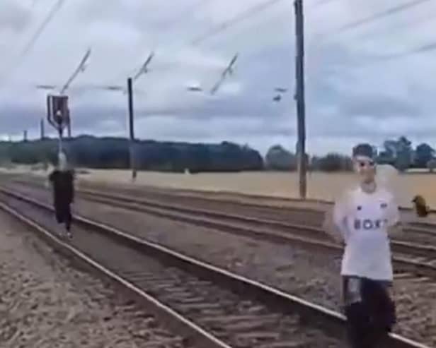 Two men were filmed running along the East Coast Main Line. (Photo: X).