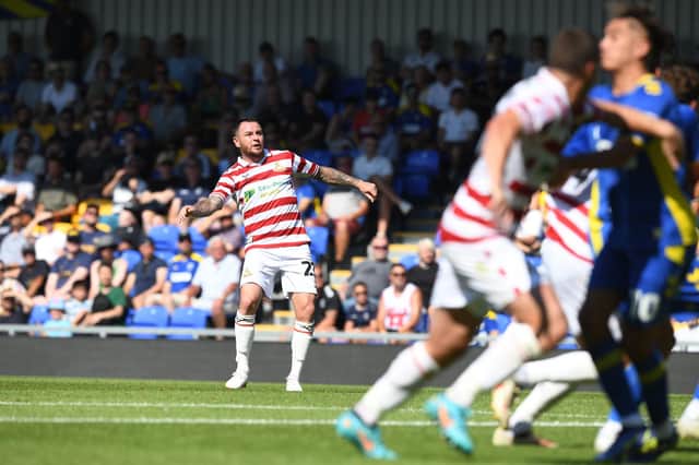 Lee Tomlin watches his freekick hit the post. Picture: Howard Roe/AHPIX LTD