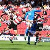 Richard Wood goes up for a header. Picture: Howard Roe/AHPIX LTD