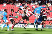 Richard Wood goes up for a header. Picture: Howard Roe/AHPIX LTD