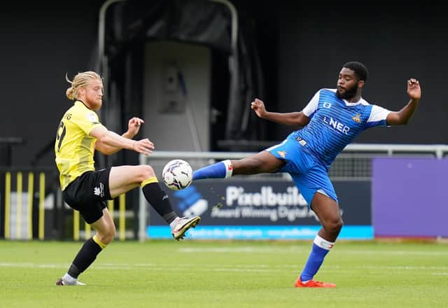 Ro-Shaun Williams competes for the ball with Harrogate's Luke Armstrong. Picture by Steve Flynn/AHPIX.com