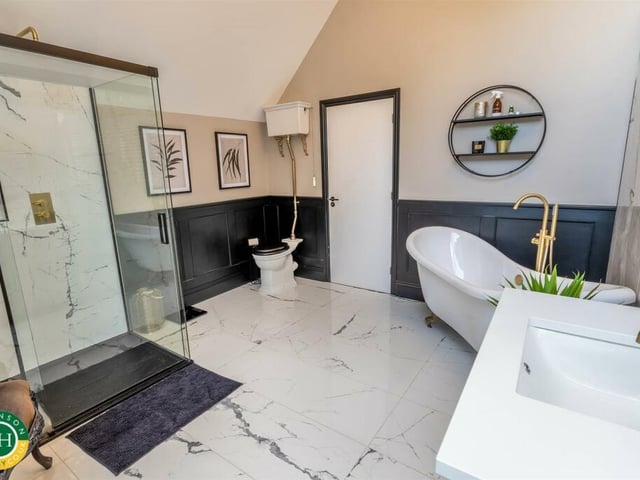 A deluxe en suite facility with freestanding bath.