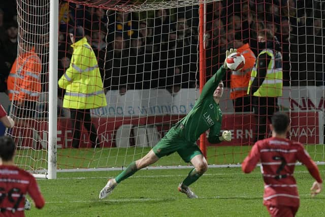 Louis Jones produces an excellent save to prevent Mansfield from going further ahead. Picture: Howard Roe/AHPIX