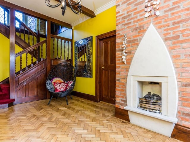 A welcoming beamed entrance hallway with parquet flooring.