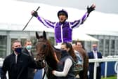 Frankie Dettori celebrates after winning the Cazoo Oaks with Snowfall at Epsom. Photo by John Walton - Pool/Getty Images