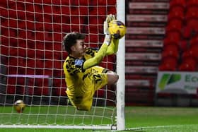 Louis Jones saves the penalty to put Rovers into the next round. Picture: Howard Roe/AHPIX.com