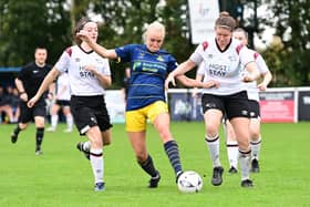 Belles’ Pheobe Sneddon is outnumbered against Derby County. Picture: Howard Roe/AHPIX LTD