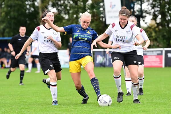Belles’ Pheobe Sneddon is outnumbered against Derby County. Picture: Howard Roe/AHPIX LTD