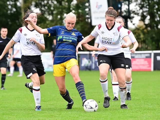 Belles’ Pheobe Sneddon is outnumbered against Derby County. Picture: Howard Roe/AHPIX LTD