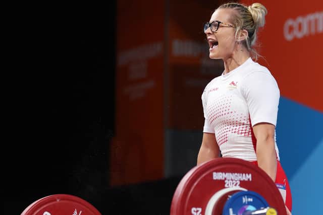 Fraer Morrow of England reacts after performing a snatch during the Women's Weightlifting 55kg Final on day two of the Birmingham 2022 Commonwealth Games at NEC Arena on July 30, 2022 on the Birmingham, England. (Photo by Clive Brunskill/Getty Images)