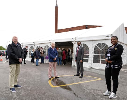 Jonathan Ellis and Natasha Mercier, DMBC Covid Team members, pictured with Ross Jones, Mayor of Doncaster and Councillor Majid Khan at the Jamia Mosque, which hosted a Pop-up first dose vaccination clinic. Picture: Marie Caley