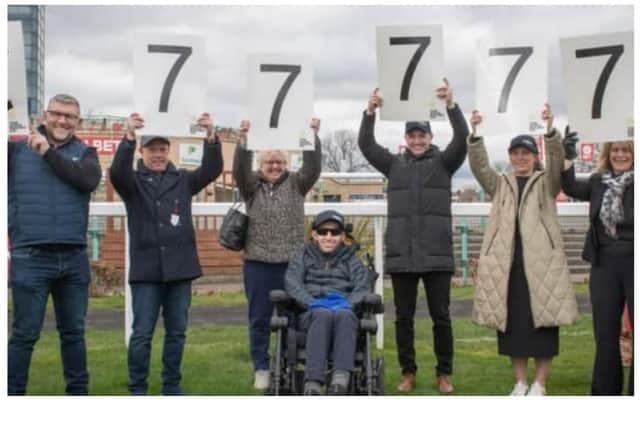 Rob and his family were presented with a donation of £77,777 by Doncaster Racecourse.