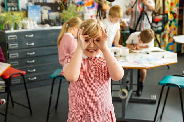 A pupil enjoying their art class