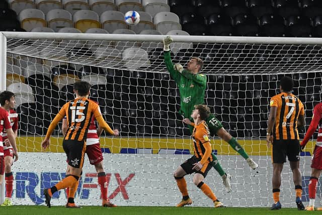 Joe Lumley punches the ball clear.  Picture: Andrew Roe/AHPIX