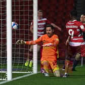 Fejiri Okenabirhie grabs an added time equaliser for Rovers against Sunderland. Picture: Andrew Roe/AHPIX