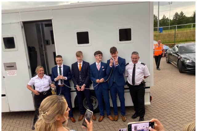 The handcuffed lads turn up at their prom in a prison van.