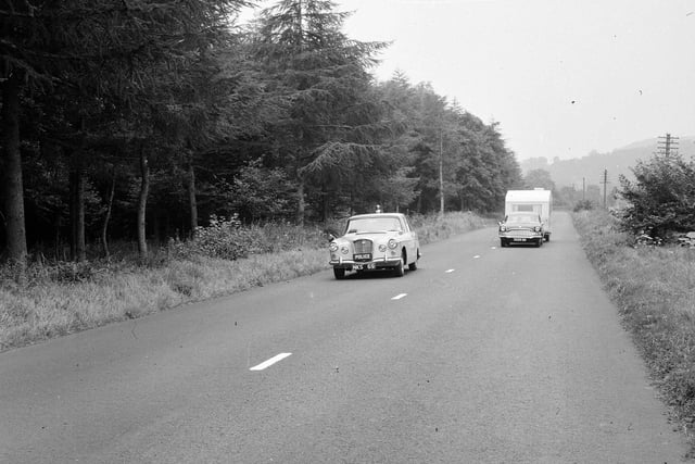 Hawick police fast driving test - a police car overtaking, August 1965.