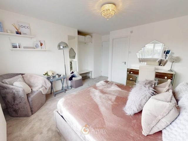 Another of the six bedrooms.