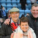All smiles from Rovers owner Terry Bramall, his wife and Chief Executive Gavin Baldwin.