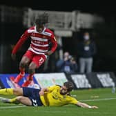 Oxford United's Elliot Lee slides in on Taylor Richards. Picture: Gareth Williams/AHPIX