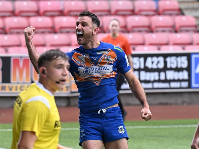 Dons' Craig Hall celebrates his try on his 400th game for the Dons at Widnes. Pic: Howard Roe