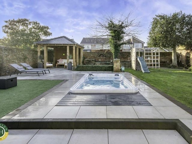 The walled garden with heated spa pool.