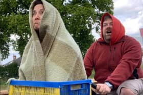 Damien and Lydia Oliver stunting up ET in their garden with a crate and a couple of hoodies