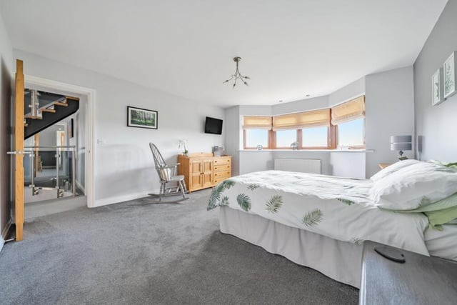 One of the spacious double bedrooms, with a bay window.