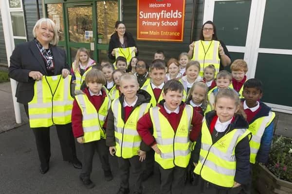 Esna Lee Of Harron Homes with Sunnyfield staff and children