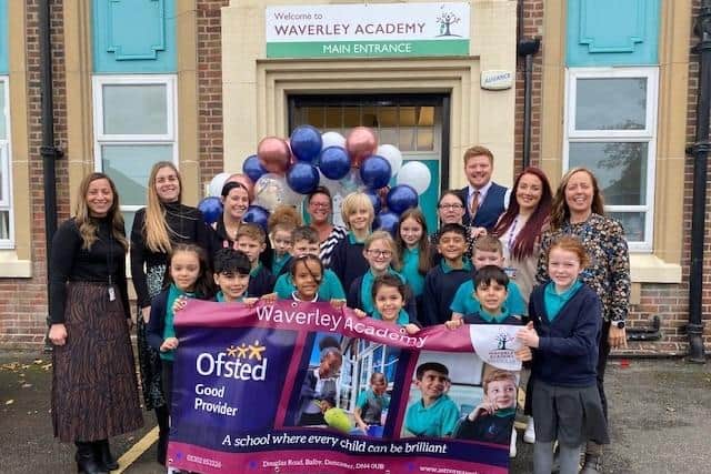 Staff and pupils celebrate their Ofsted