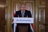 British Prime Minister Boris Johnson gestures as he gives a press conference about the ongoing situation with the coronavirus (COVID-19) outbreak inside 10 Downing Street on March 18, 2020 in London, England. (Photo by Eddie Mulholland - WPA Pool/Getty Images)