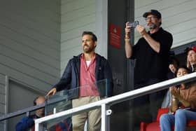 Wrexham co-owner Ryan Reynolds attended their first game of the season with actor Hugh Jackman (photo by Malcolm Couzens/Getty Images).