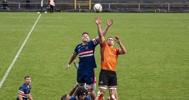 Doncaster Knights' Matt Smith competes with Trailfinders captain Rayn Smid at the lineout. Photo: Tony Johnson