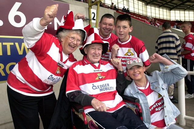 Chas Walker (centre), his wife Pat, their son Les and their grandchilden, Martin and Kim, aged 13, and 17, get behind their team........Rovers! May 10, 2003