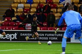 Jon Taylor crosses the ball against York.