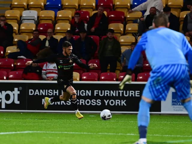 Jon Taylor crosses the ball against York.