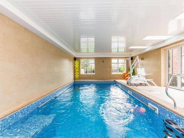 The heated swimming pool is part of a complex, with a hydro pool and changing rooms with showers.