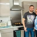 Barbara and her son Andrew in the kitchen of their new home